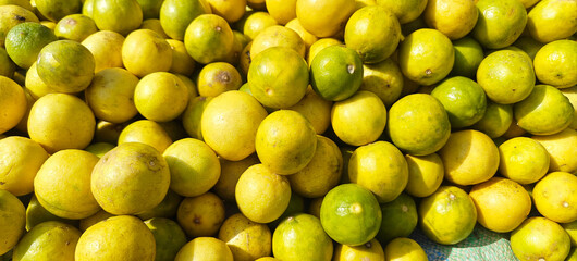 A pile of fresh lemon open sell in Indian market.