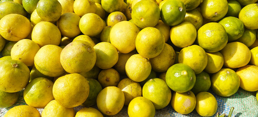 A pile of fresh lemon open sell in Indian market.