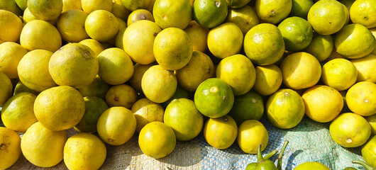 A pile of fresh lemon open sell in Indian market.
