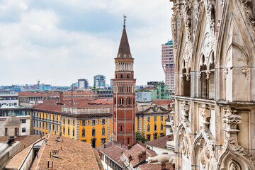 Fototapeta premium View from top of Duomo di Milano with the Bell tower of the catholic church of San Gottardo in Corte at the Royal Palace