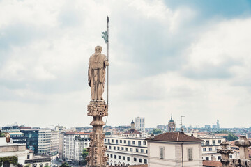 Obraz premium View from the rooftop of the Milan Cathedral (Duomo di Milano), one of the most famous Gothic cathedrals in the world, overlooking the city of Milan, Italy