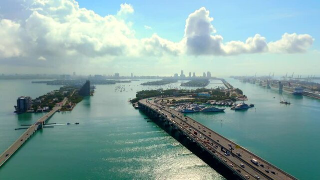 Miami Florida landscape. Aerial drone video heading eastward over bridges and bay 4k