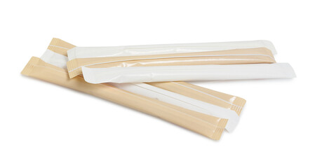 white and brown sugar in paper sticks