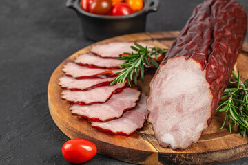 smoked sausage on a wooden background. top view. copy space