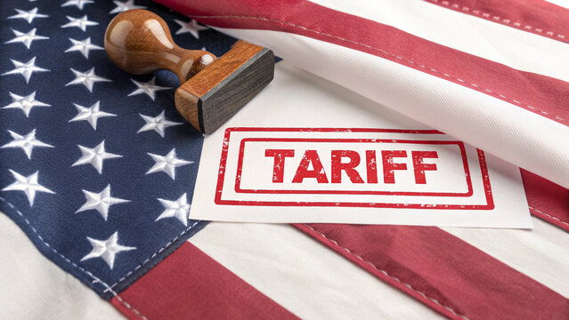 The U.S. flag is marked with a bold red Tariff stamp, symbolizing government-imposed trade barriers and their impact on national economic policy..