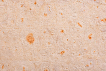 Thin pita bread as a background macro photo. Food background.