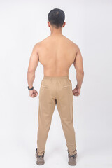 Fototapeta premium muscular Asian young man and fit body wearing scuba jogger pants