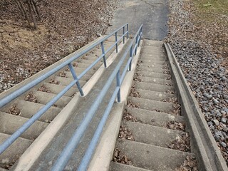 Walking down concrete stairs stepping personal perspective