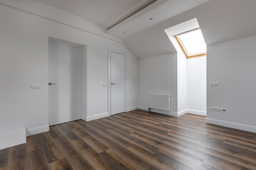 Bright Attic Room with Skylight and Wooden Floor