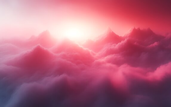 Pink sunrise over mountain peaks above clouds.