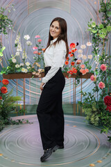 Portrait of beautiful, young woman, organizer of the wedding, on background of a beautiful decor.