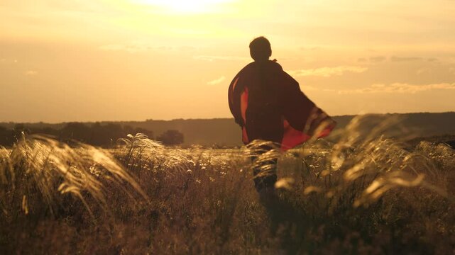 Boy with a red cape in a wheat field, The warmth of a summer sunset, A child&rsquo;s imagination takes flight, Running into the horizon with joy, A superkid embracing his dreams, Golden hues paint the