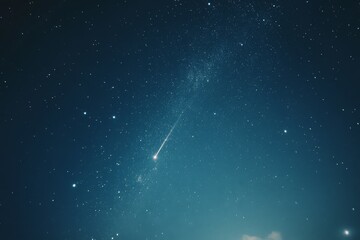 A lone meteor illuminates the starry night sky, creating a sense of awe and celestial beauty.