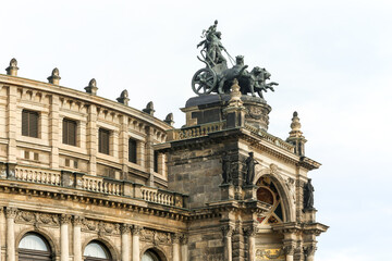 Fototapeta premium A large building Semper Opera in Dresden Germany with a statue of a chariot on top