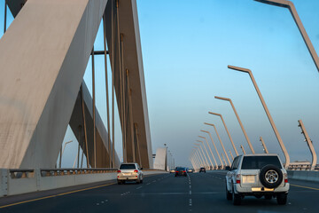 Sheikh Zayed Bridge in Abu Dhabi, UAE. Driving from the island to mainland, blue sky