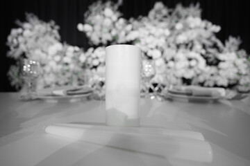 Close-up of candles with name and date on the table of the bride and groom at the wedding banquet.