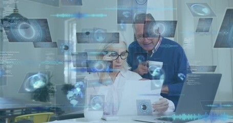 Elderly couple reviewing documents with digital data processing animation overlay - Powered by Adobe