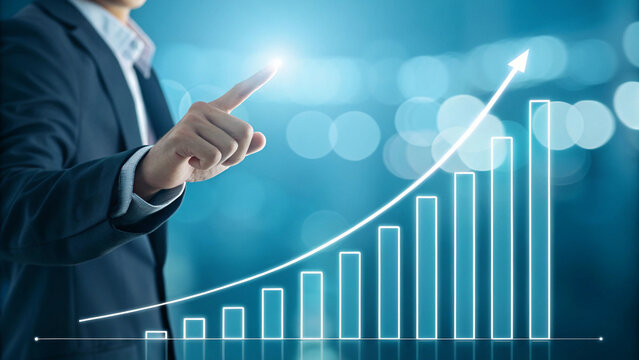 Business Growth Success Concept – Hand Pointing at Rising Bar Chart with Arrow