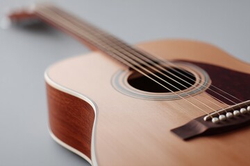 Fototapeta premium close-up of minimalist acoustic guitar scene with focus on strings and soundhole