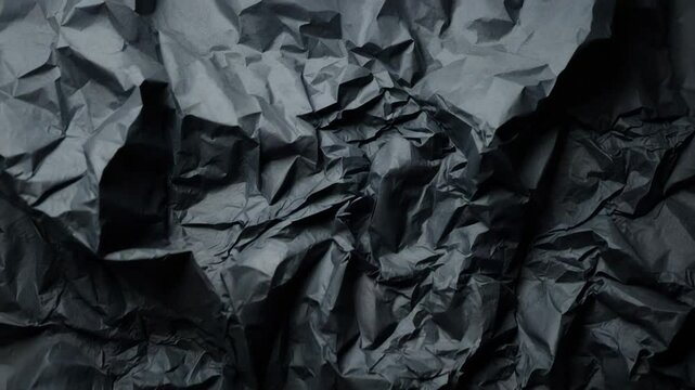 Black paper backdrop with a wrinkled texture
