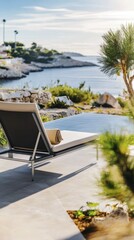 Tranquil coastal retreat with lounge chair overlooking serene seaside at sunset