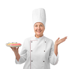 Professional pastry chef with eclairs on white background