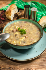 Traditional polish soup Zurek in ceramic bowl.