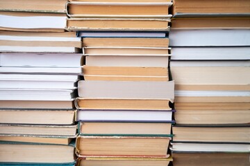 Many old books stacked in texture