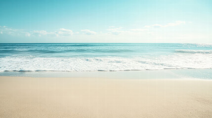 Fototapeta premium Seashore Serenity: A tranquil view of the sandy shore merging with the vast ocean under a clear sky, evoking a sense of peace and boundless freedom. 