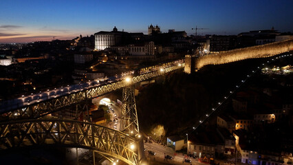 Sunset Dom Luis I Bridge At Porto In District Of Porto Portugal. Sunset Skyline Scene. Illuminated...