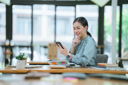Portrait successful businesswoman, asian woman shows a report of financial documents online interlocutors in the laptop screen, an employee inside an office building online video conference.