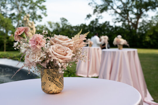 Blush floral centerpiece on cocktail table