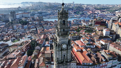 Naklejka premium Clerigos Tower At Porto In Porto District Portugal. Catholic Church. Downtown Cityscape. Medieval Building. Clerigos Tower At Porto District In Portugal. Lisbon Square.