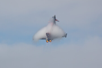 military jet fighter with after burner