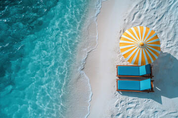 Relaxing beach scene with umbrella and sunbeds on white sand by turquoise water
