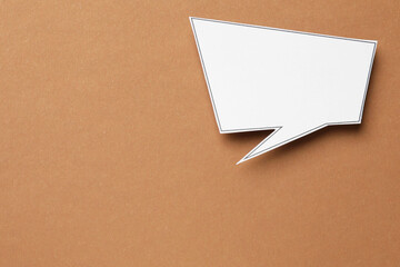 Blank speech bubble on brown background, top view. Space for text