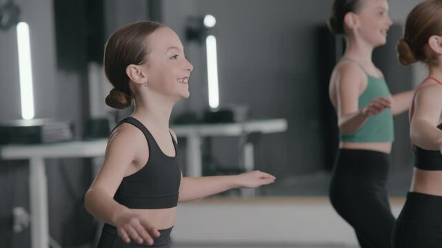 Young girls in a stylish studio doing a tap dance routine