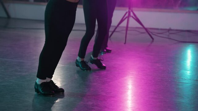 Young girls in a stylish studio doing a tap dance routine