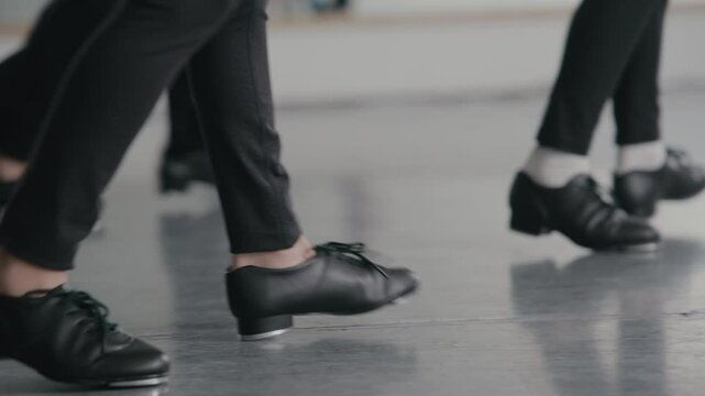 Young girls in a stylish studio doing a tap dance routine