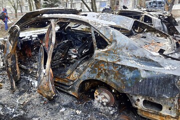 Burnt cars in parking lot, the car interior burned. Russia s war against Ukraine, drone attack on...