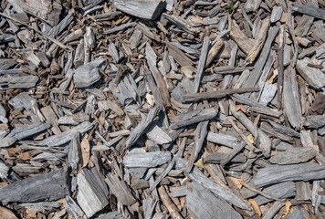 A pile of wood chips with a lot of different sizes