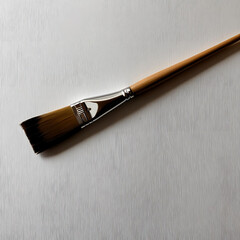 Fototapeta premium The image shows a paintbrush with wide, soft, flat bristles. The handle is a natural wood color with a shiny metal part, giving it a professional look