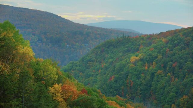 Captured by drone, this footage showcases the Catskill Mountains in New York, likely near Kaaterskill Falls, featuring the mountainous terrain and autumn colors.
