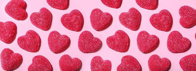 Sweet jelly candies in shape of hearts on pink background. Valentine's Day celebration