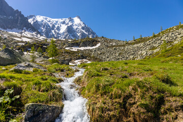 Aiguille du Midi peak in the Alps. Chamonix valley landscape of a prominent rocky towering mountain peak in French Alps. Chamonix-Montblanc area beautiful landscape of Aiguille du Midi summit, France