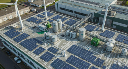 A sprawling factory complex harnesses the sun's energy, a testament to sustainable innovation and a brighter future, showcasing extensive solar panels and wind turbines in an aerial view.