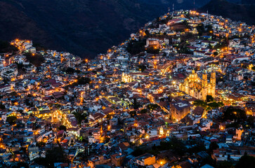 Nighttime panoramic view of Taxco, a historic silver-mining town in Guerrero, Mexico