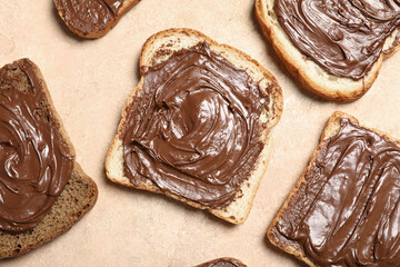 Toasts with sweet chocolate spread on beige background