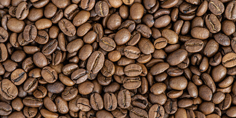 Roasted coffee beans as a background macro photo. Food, drink coffee.