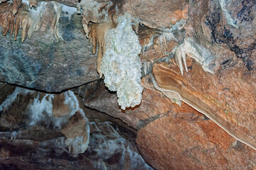 A rock wall with a white substance on it